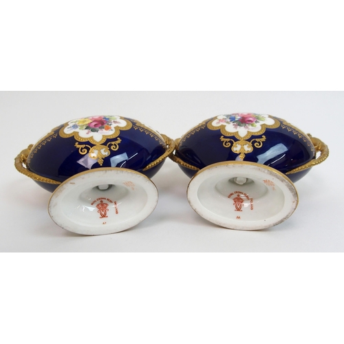 501 - A pair of Royal Crown Derby urns and covers