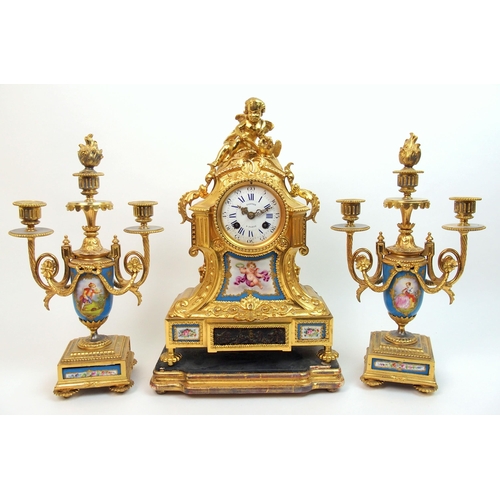 505 - A French gilt metal and porcelain clock garniture by Gantier  Paris