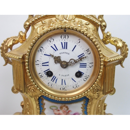 505 - A French gilt metal and porcelain clock garniture by Gantier  Paris