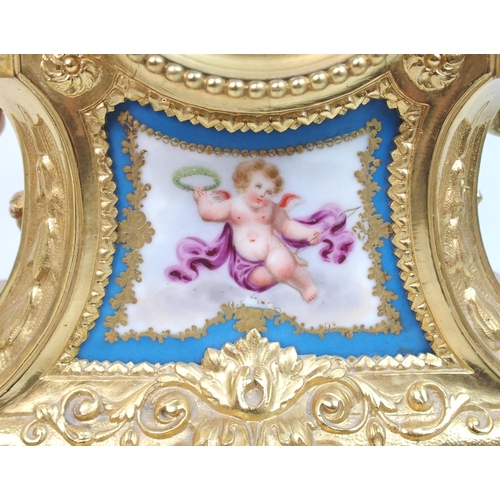 505 - A French gilt metal and porcelain clock garniture by Gantier  Paris