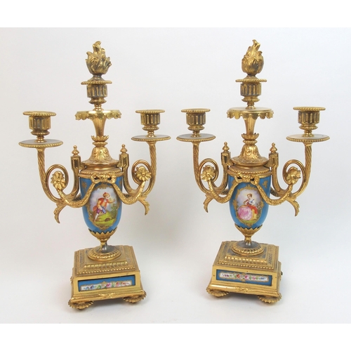 505 - A French gilt metal and porcelain clock garniture by Gantier  Paris