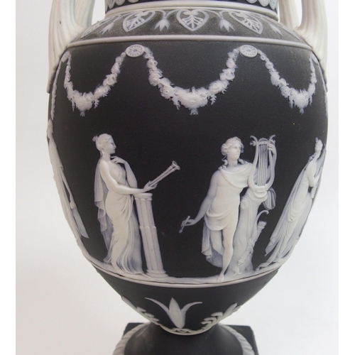 509 - A Wedgwood black jasper dip two-handled urn and cover