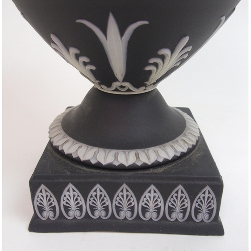 509 - A Wedgwood black jasper dip two-handled urn and cover