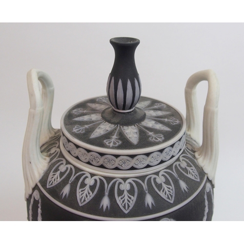 509 - A Wedgwood black jasper dip two-handled urn and cover