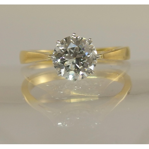 639 - An 18ct yellow and white gold diamond solitaire ring