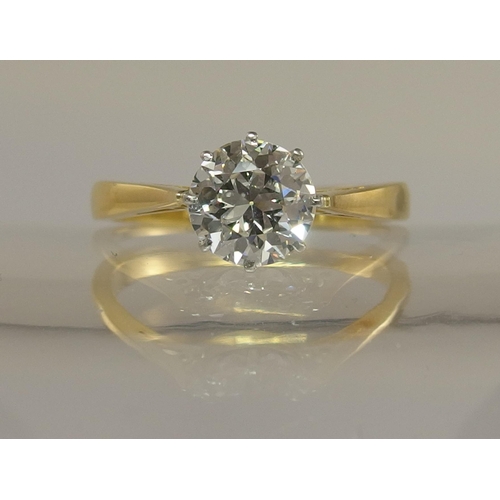 639 - An 18ct yellow and white gold diamond solitaire ring