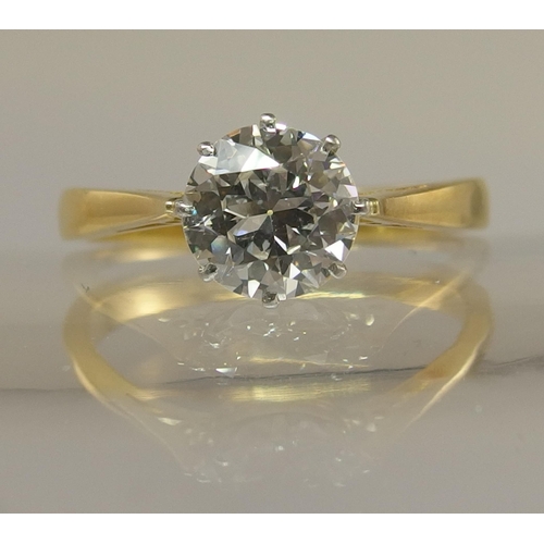 639 - An 18ct yellow and white gold diamond solitaire ring