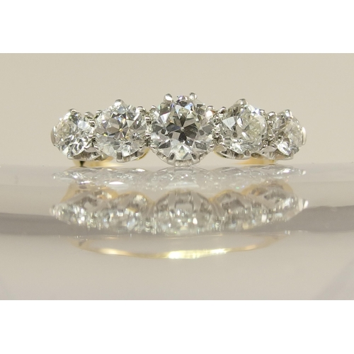 640 - An 18ct gold and platinum five stone diamond ring