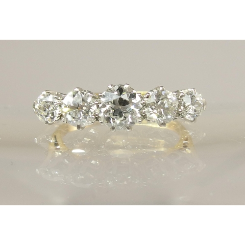 640 - An 18ct gold and platinum five stone diamond ring