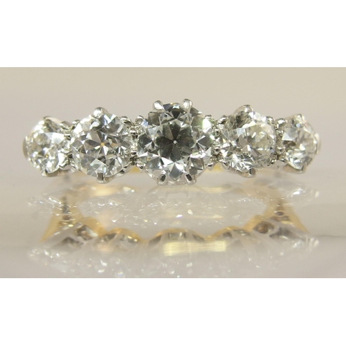 640 - An 18ct gold and platinum five stone diamond ring