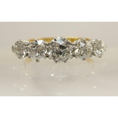 640 - An 18ct gold and platinum five stone diamond ring