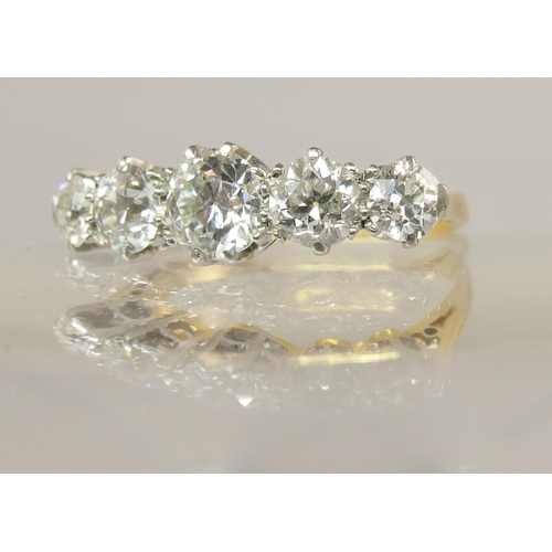 640 - An 18ct gold and platinum five stone diamond ring