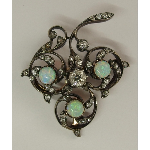 645 - An opal and diamond brooch