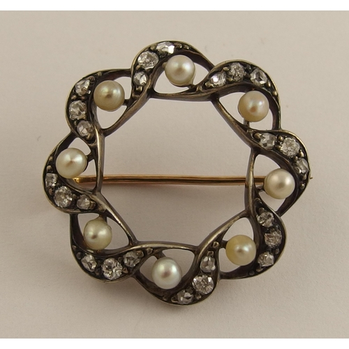 646 - A diamond and pearl circle brooch