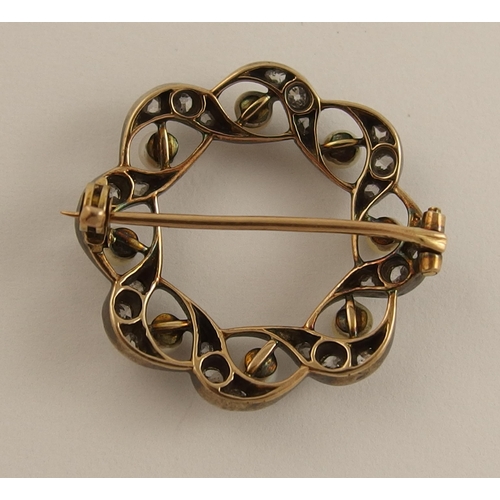 646 - A diamond and pearl circle brooch