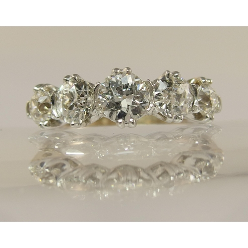 653 - An 18ct gold five stone diamond ring