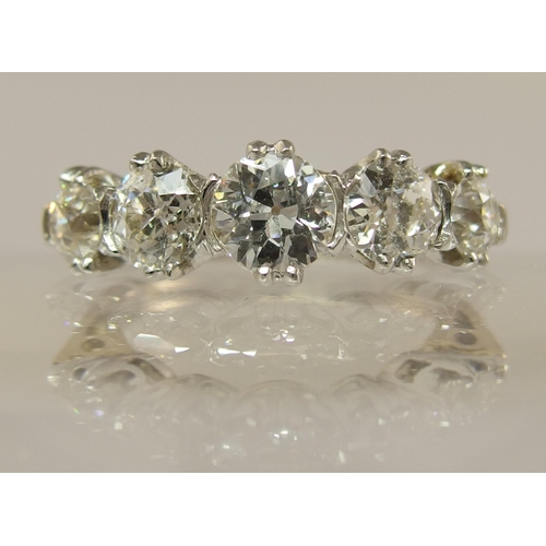 653 - An 18ct gold five stone diamond ring