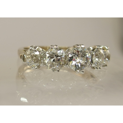 653 - An 18ct gold five stone diamond ring