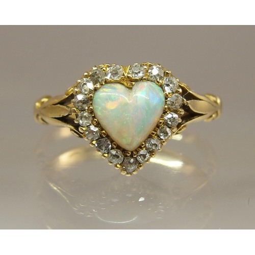 668 - An 18ct gold opal heart and diamond ring