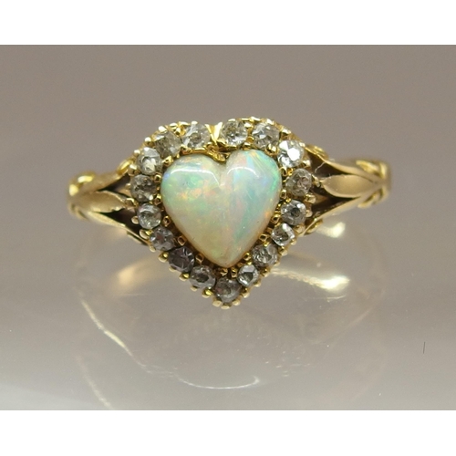 668 - An 18ct gold opal heart and diamond ring