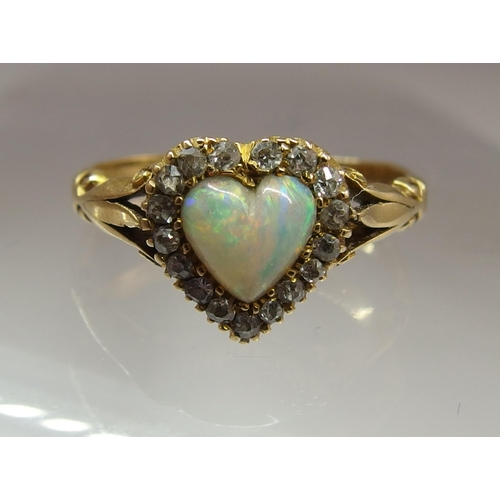 668 - An 18ct gold opal heart and diamond ring