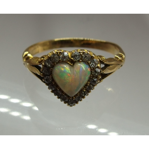 668 - An 18ct gold opal heart and diamond ring