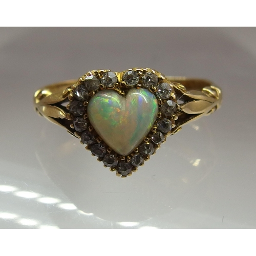 668 - An 18ct gold opal heart and diamond ring