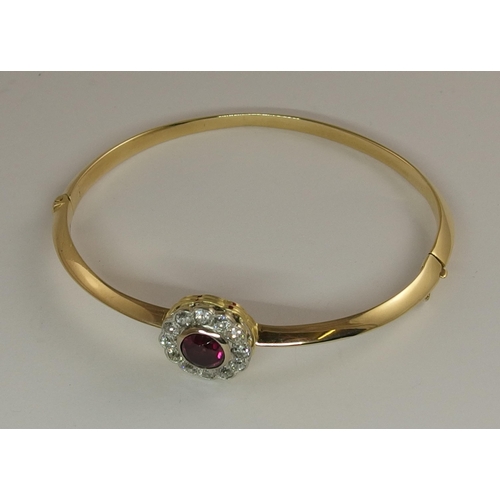 669 - A ruby and diamond bangle