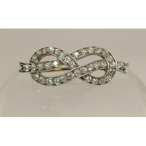 688 - A diamond lover's knot brooch