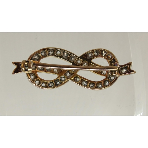 688 - A diamond lover's knot brooch