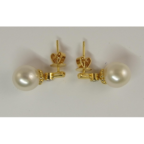 690 - A pair of 18ct gold diamond and pearl earrings