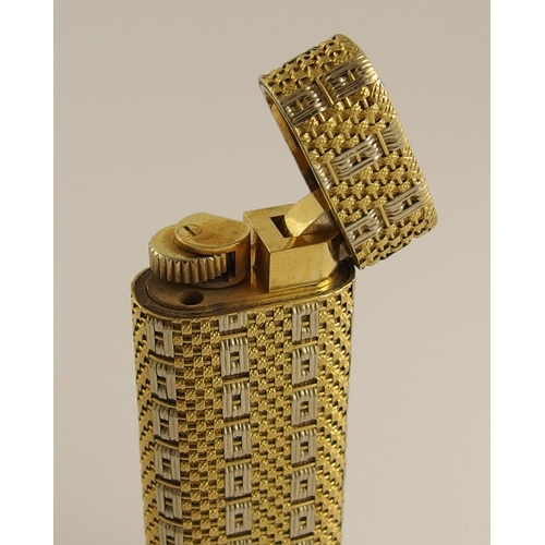 698 - An 18ct gold Cartier lighter