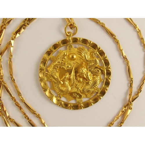 702 - A Chinese high carat gold pendant and chain