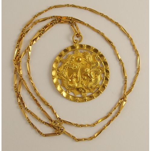 702 - A Chinese high carat gold pendant and chain