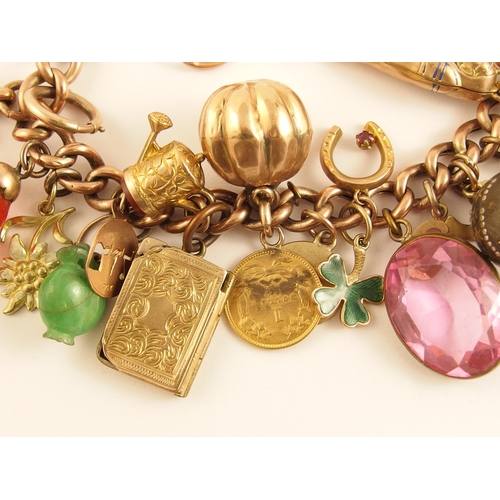 746 - A 9ct gold charm bracelet