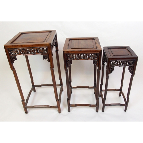 802 - A Chinese rosewood nest of three pedestal tables