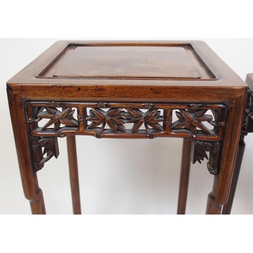 802 - A Chinese rosewood nest of three pedestal tables