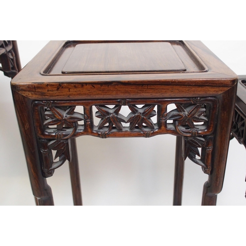 802 - A Chinese rosewood nest of three pedestal tables