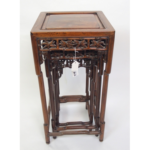 802 - A Chinese rosewood nest of three pedestal tables