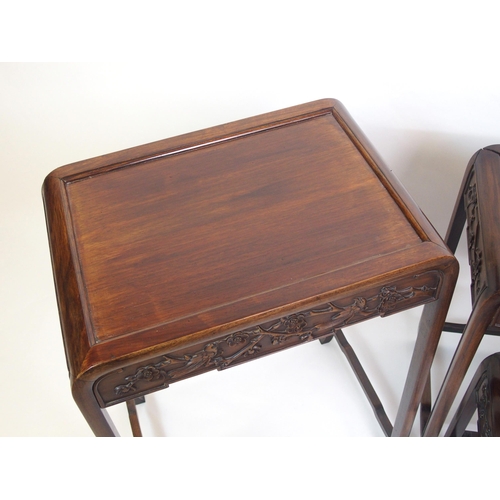 806 - A Chinese hardwood nest of four rectangular pedestal tables