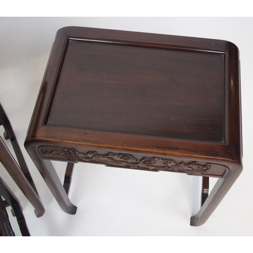 806 - A Chinese hardwood nest of four rectangular pedestal tables