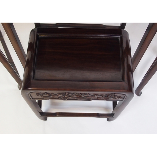 806 - A Chinese hardwood nest of four rectangular pedestal tables