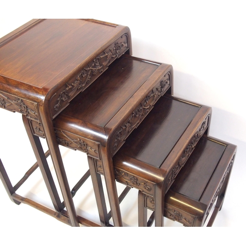 806 - A Chinese hardwood nest of four rectangular pedestal tables