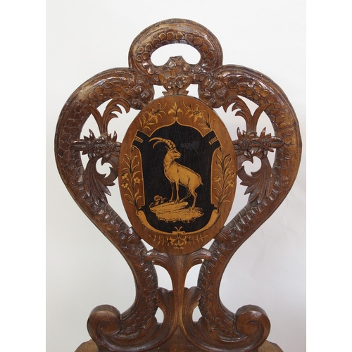 810 - A pair of Bavarian stained  inlaid and carved hall chairs