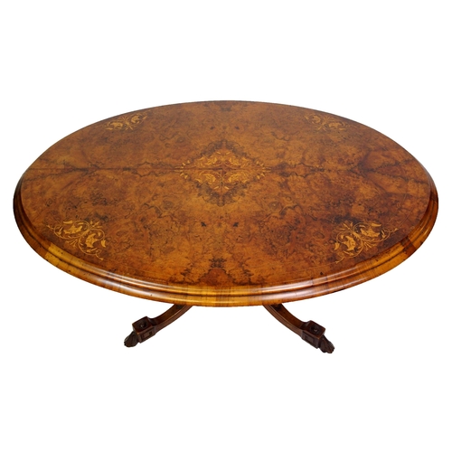 813 - A Victorian walnut oval inlaid breakfast table