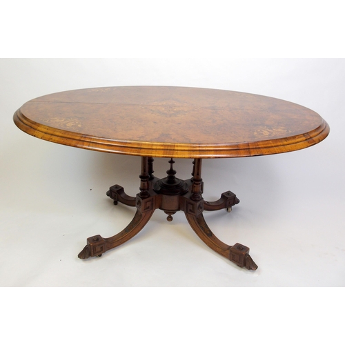 813 - A Victorian walnut oval inlaid breakfast table