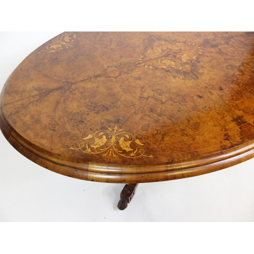 813 - A Victorian walnut oval inlaid breakfast table