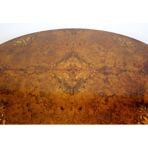 813 - A Victorian walnut oval inlaid breakfast table