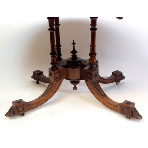 813 - A Victorian walnut oval inlaid breakfast table