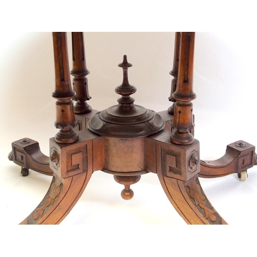 813 - A Victorian walnut oval inlaid breakfast table